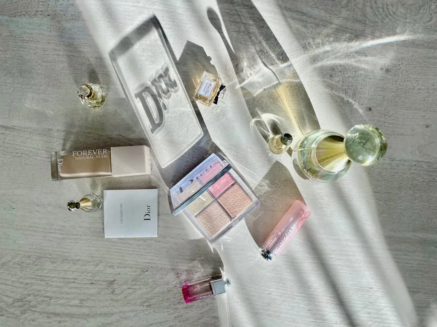 High-angle shot of Dior cosmetics and perfumes casting artistic shadows. - affordable luxury daily goods that feel highend