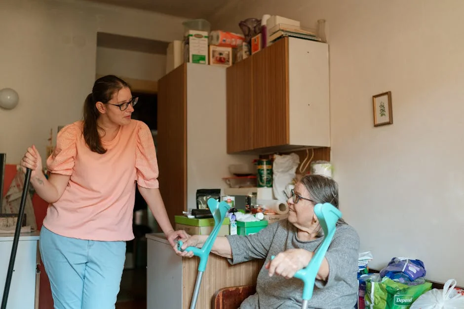 A caregiver engaging with a senior using crutches in a cozy Prague home environment. - best daily essentials for elderlyfriendly home living