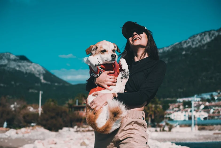Woman holding a dog outdoors in Kumluca, Antalya. A joyful moment with nature as a backdrop. - best value daily goods for pet owners on a budget