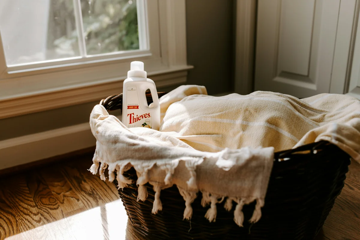 Thieves Detergent in Laundry Basket - comparing the most popular ecofriendly laundry detergents
