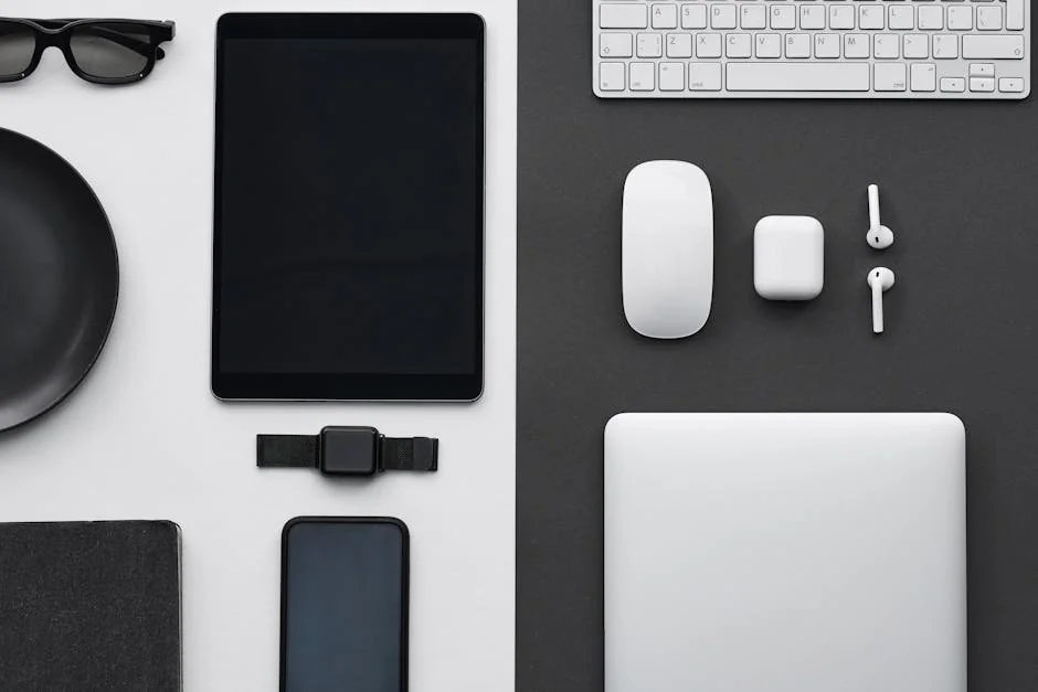 Stylish flatlay of modern tech gadgets including tablet, smartphone, smartwatch, and accessories. - factors to consider before upgrading your daily tech gadgets