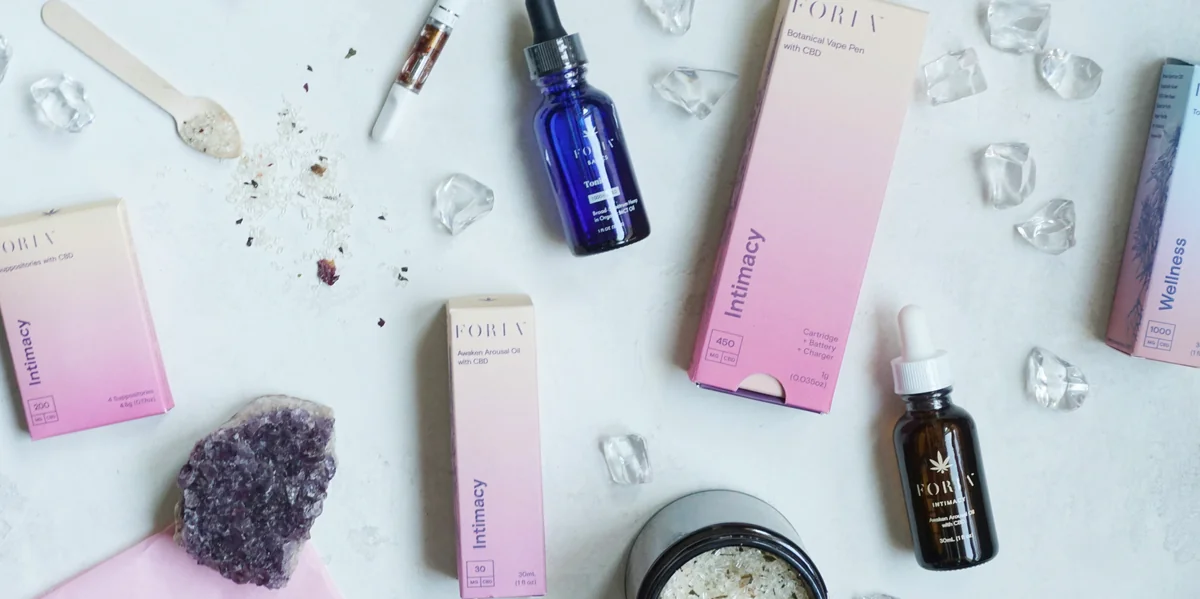 blue glass bottle beside white box - highquality selfcare products for an improved daily routine