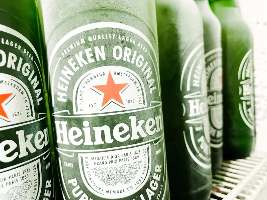 Chilled Heineken beer bottles neatly arranged in a refrigerator, ready to enjoy. - honest comparison of premium vs generic household brands