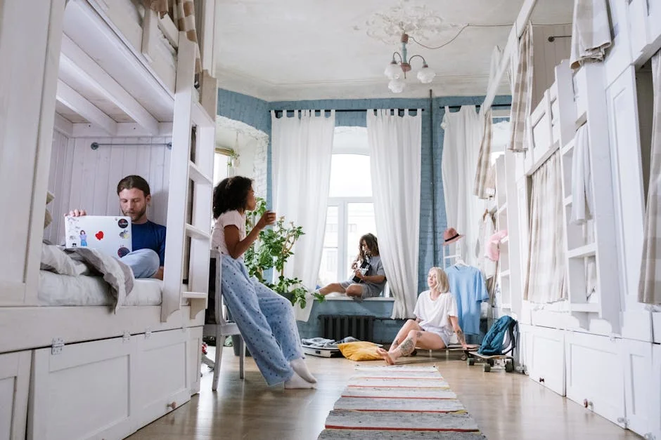A cozy dorm room where friends relax, chat, play guitar, and use laptops together. A casual hangout environment. - musthave daily goods for college students in dorms