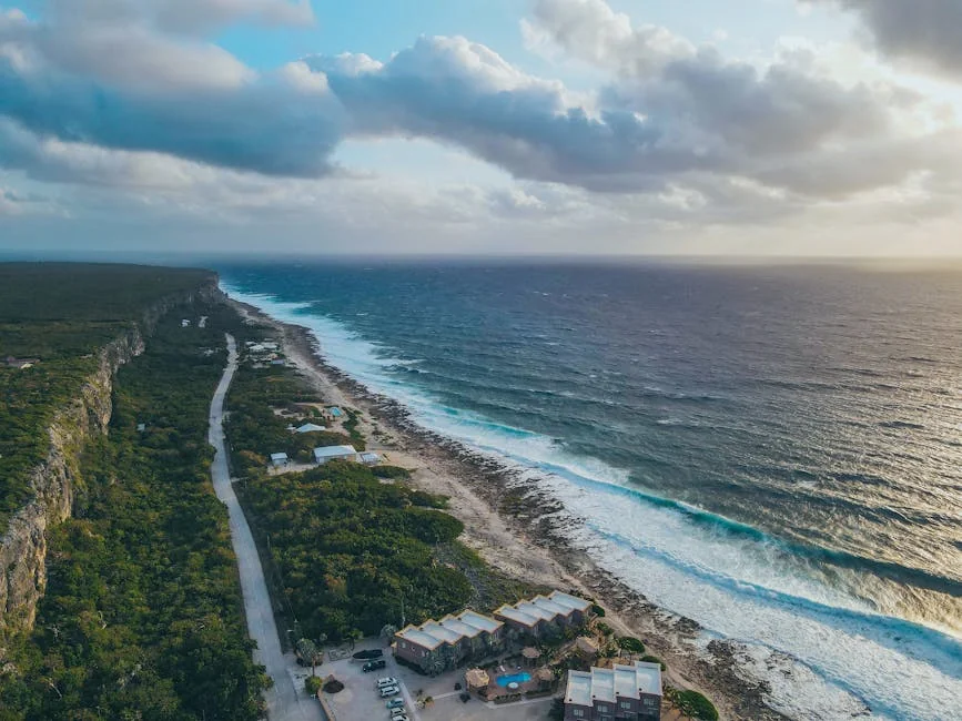 Stunning aerial view of Breakers coastline, Cayman Islands, capturing the ocean and beach. - adventure vacation destination - Rare and useful travel essentials for frequent commuters