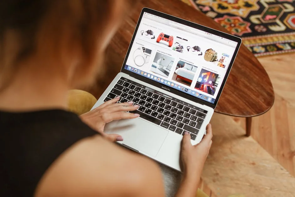 A woman shops online on her laptop while seated in a cozy home environment. - valuebased shopping guide for highfrequency use items